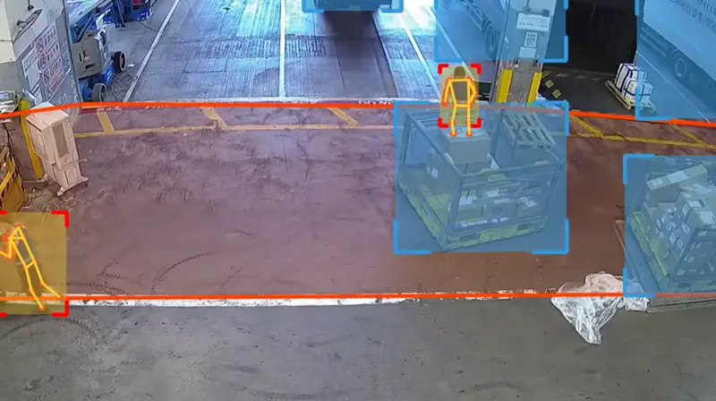 Worker at height near trailers and dock edges