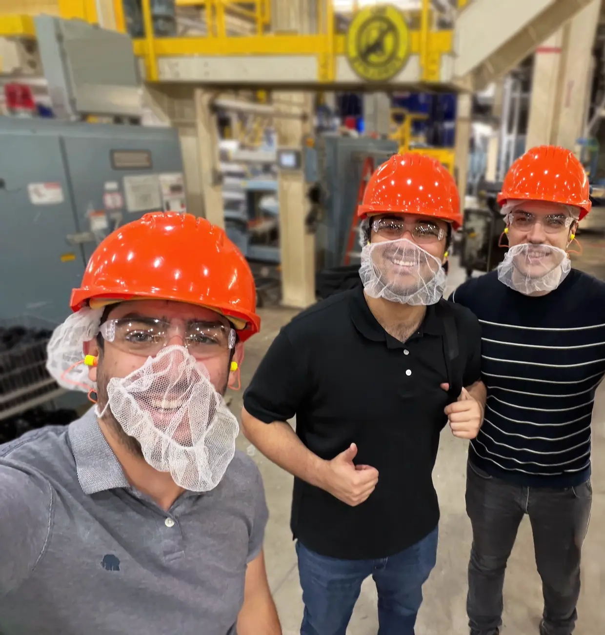 Intenseye forward-deployed engineers on a plant floor in PPE